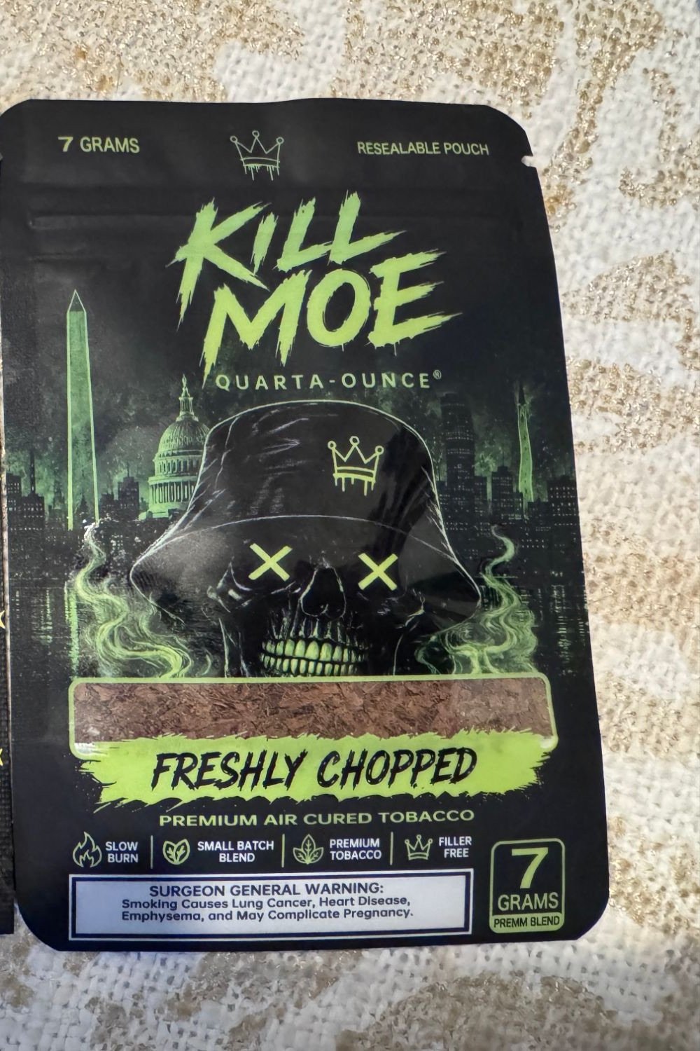 A real Kill Moe 7 gram pouch photographed on a table